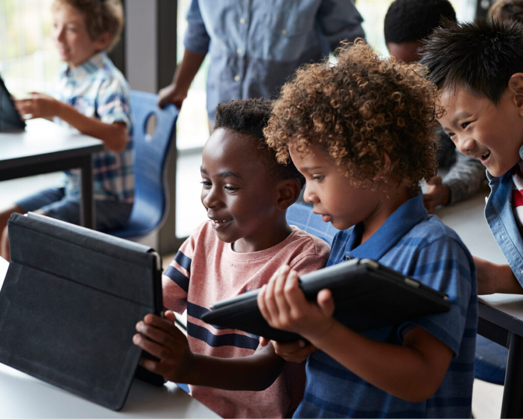 Children holding tablets